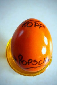 egg head is the "Kopf" and the most narrow part of the ovid. Egg butt is the "Popsch" or "Po" and is the "bottom" part of the egg.